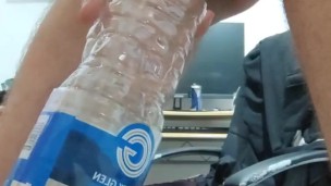 Pissing in the empty bottle like a champ